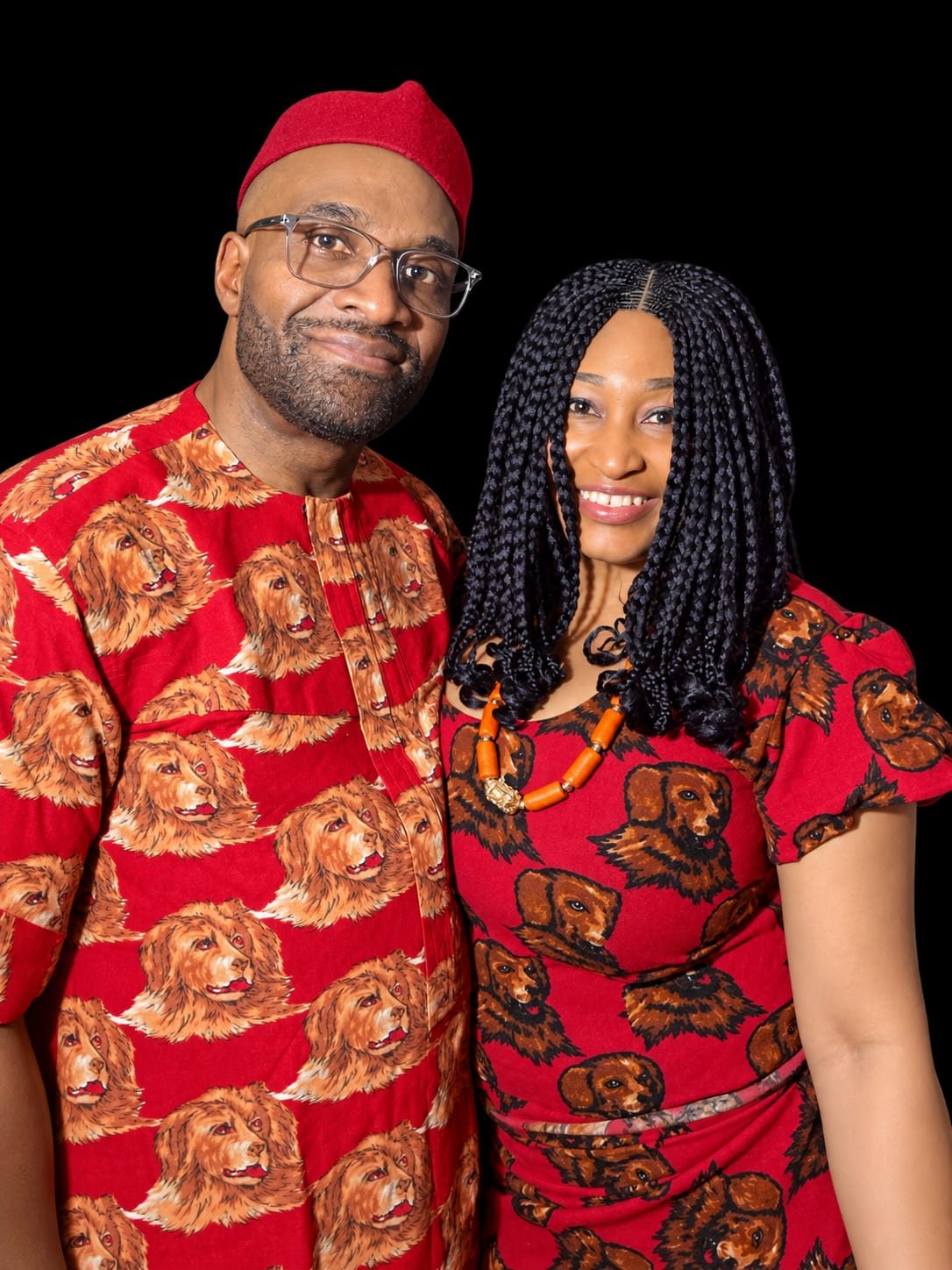 Lilian and Conrad in matching red traditional Igbo attire